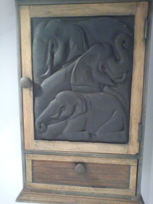 Bathroom cabinet, with elephants carved all over the door
