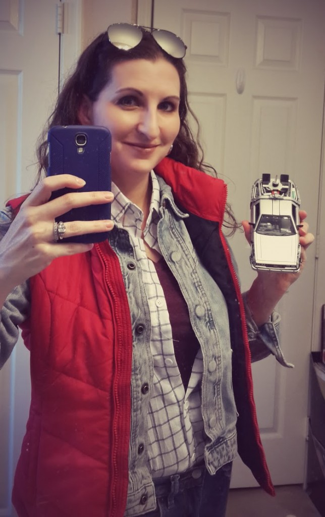 Teaser shot: me in my female Marty McFly Cosplay costume holding a miniature DeLorean time machine... to be continued.