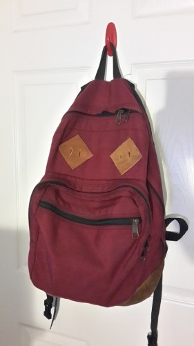 I made minor modifications to a vintage Jansport backpack to give it the look of Marty's Eastpak. By getting the maroon color with suede bottom and adding some leather "pig ear" patches, it looked really good for very tiny investment.